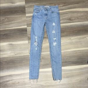 Levi’s super high rise super skinny Light Blue Distressed Jeans size 24